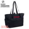Black quilted tote with front pocket