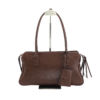 Brown barrel handbag with two long handles and hanging tag