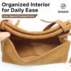 Open tan shoulder bag showing interior pocket